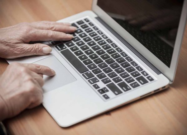 health news on a laptop keyboard